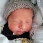 Jackson in his new hat knitted by Karen!
